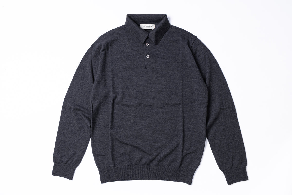 A dark charcoal gray long-sleeve knit polo sweater with a buttoned collar, laid flat against a solid white background.