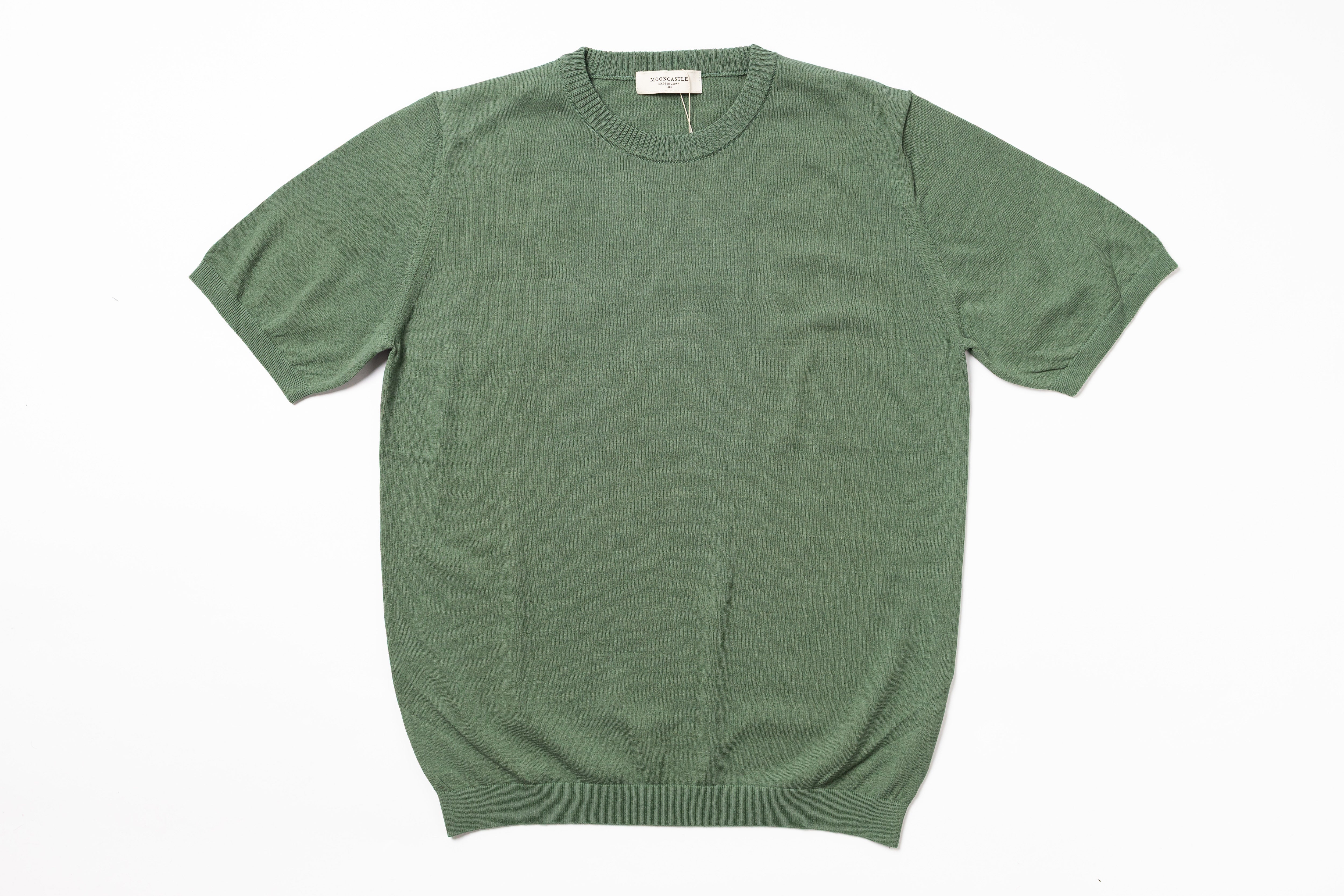 Green t-shirt on a white background
