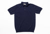 Navy blue polo shirt on a white background