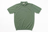 Green polo shirt on a white background