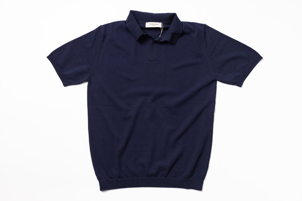 Navy blue polo shirt on a white background