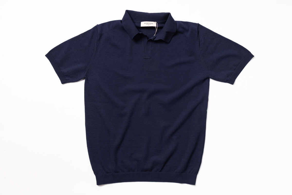 Navy blue polo shirt on a white background