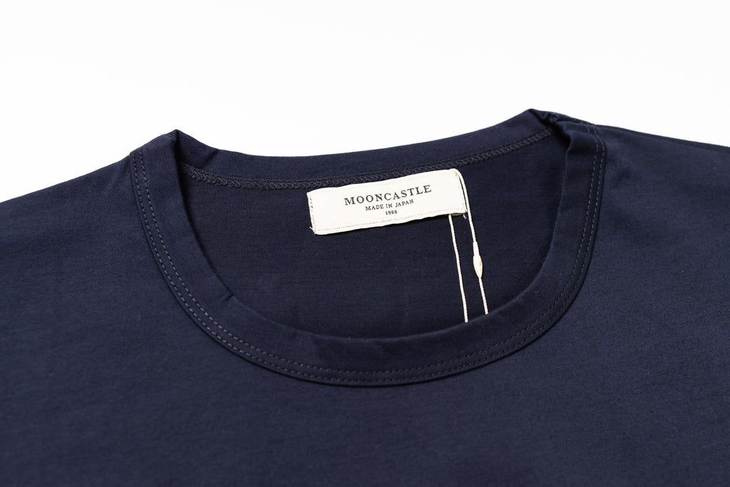 Navy blue shirt with a visible brand label on a white background