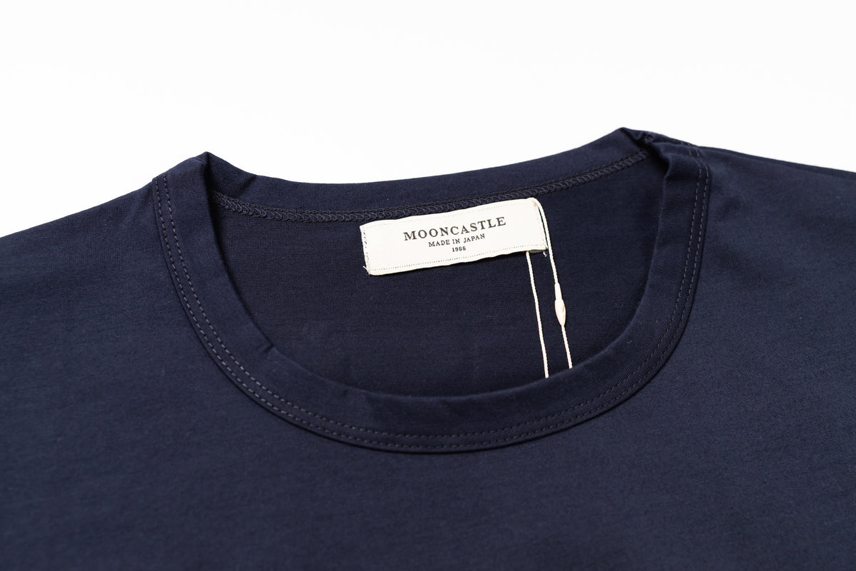 Navy blue shirt with a visible brand label on a white background