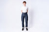 Person wearing a white shirt and blue jeans on a white background
