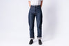 Person wearing blue jeans on a white background