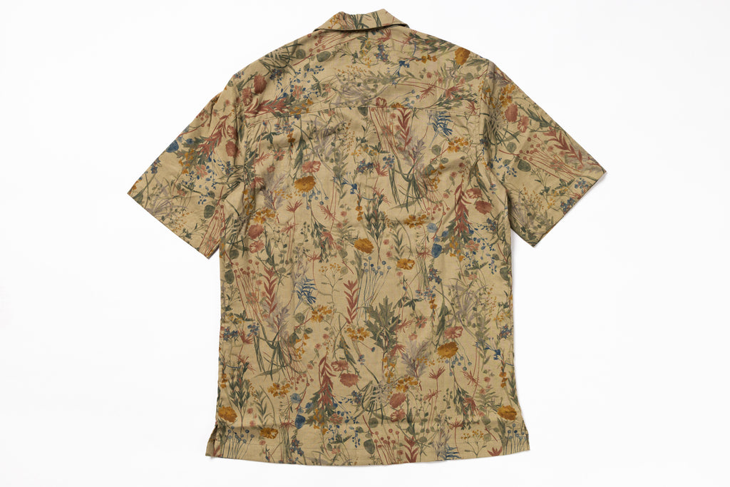 Short-sleeve shirt with a floral pattern on a white background