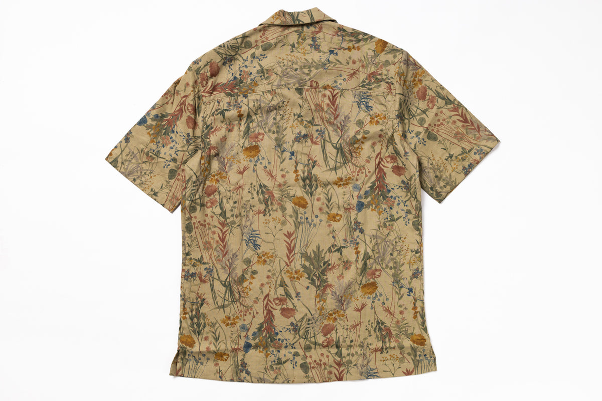 Short-sleeve shirt with a floral pattern on a white background