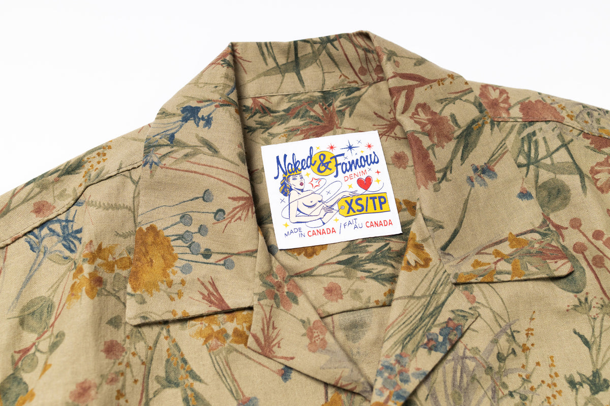 Floral patterned shirt with a 'Naked & Famous' label on a white background