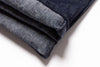 Folded denim fabric on a white background