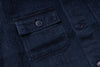 Close-up of a dark blue textured fabric with buttons