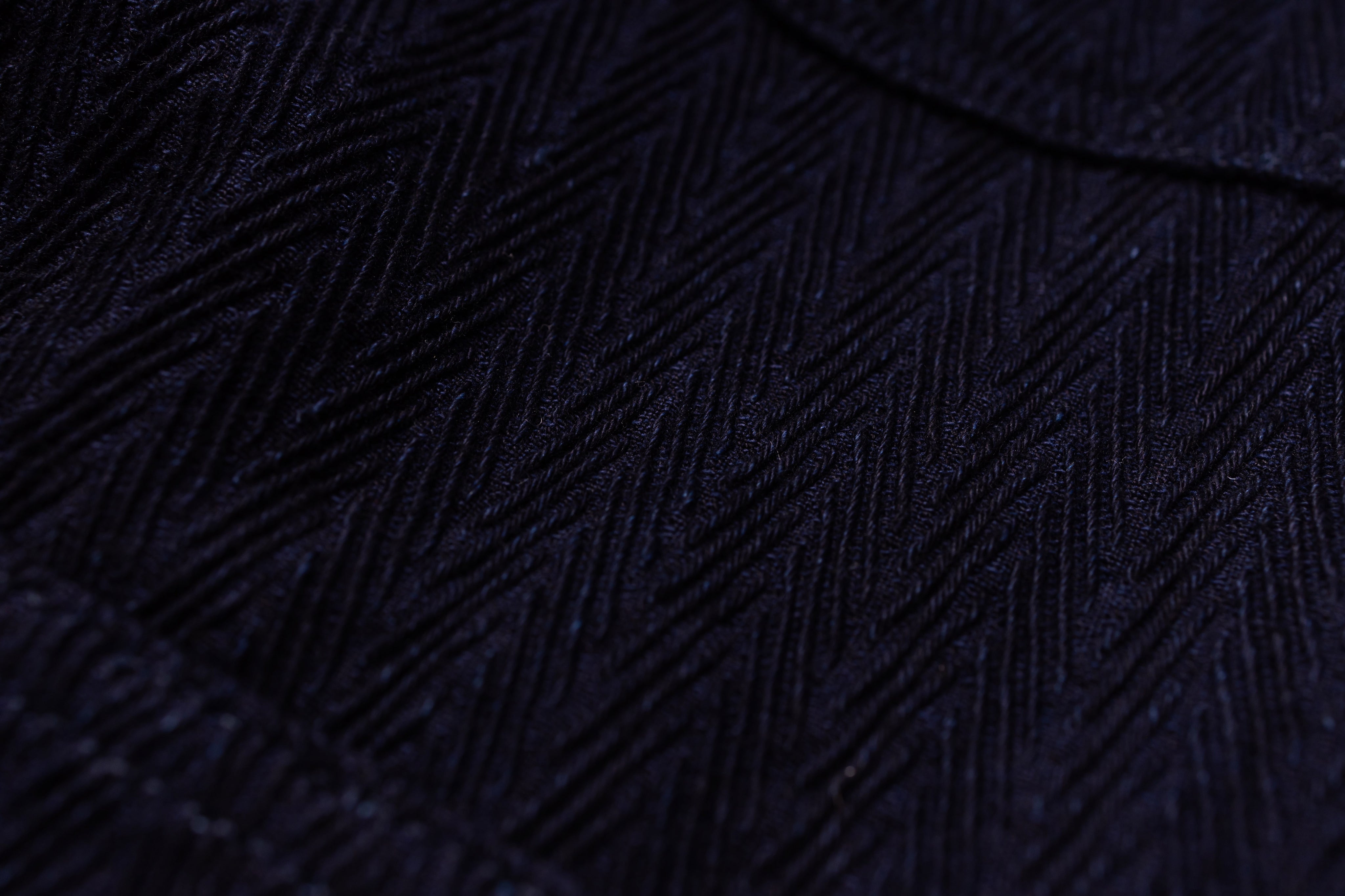 Close-up of a textured black fabric surface