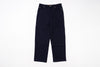 A pair of dark navy blue denim pants laid flat against a solid white background.