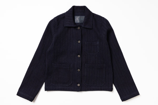 Dark blue jacket with button details on a white background