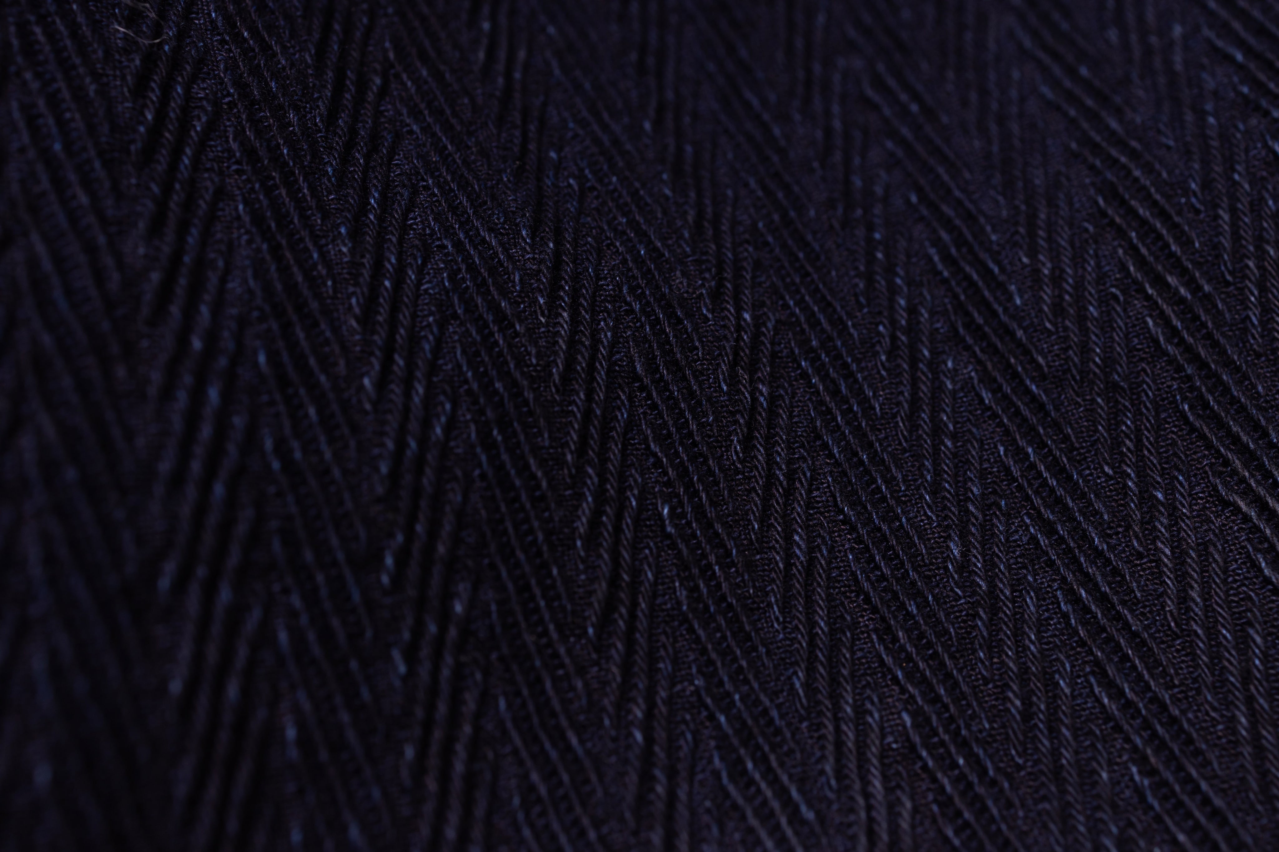 Dark blue textured fabric with geometric pattern