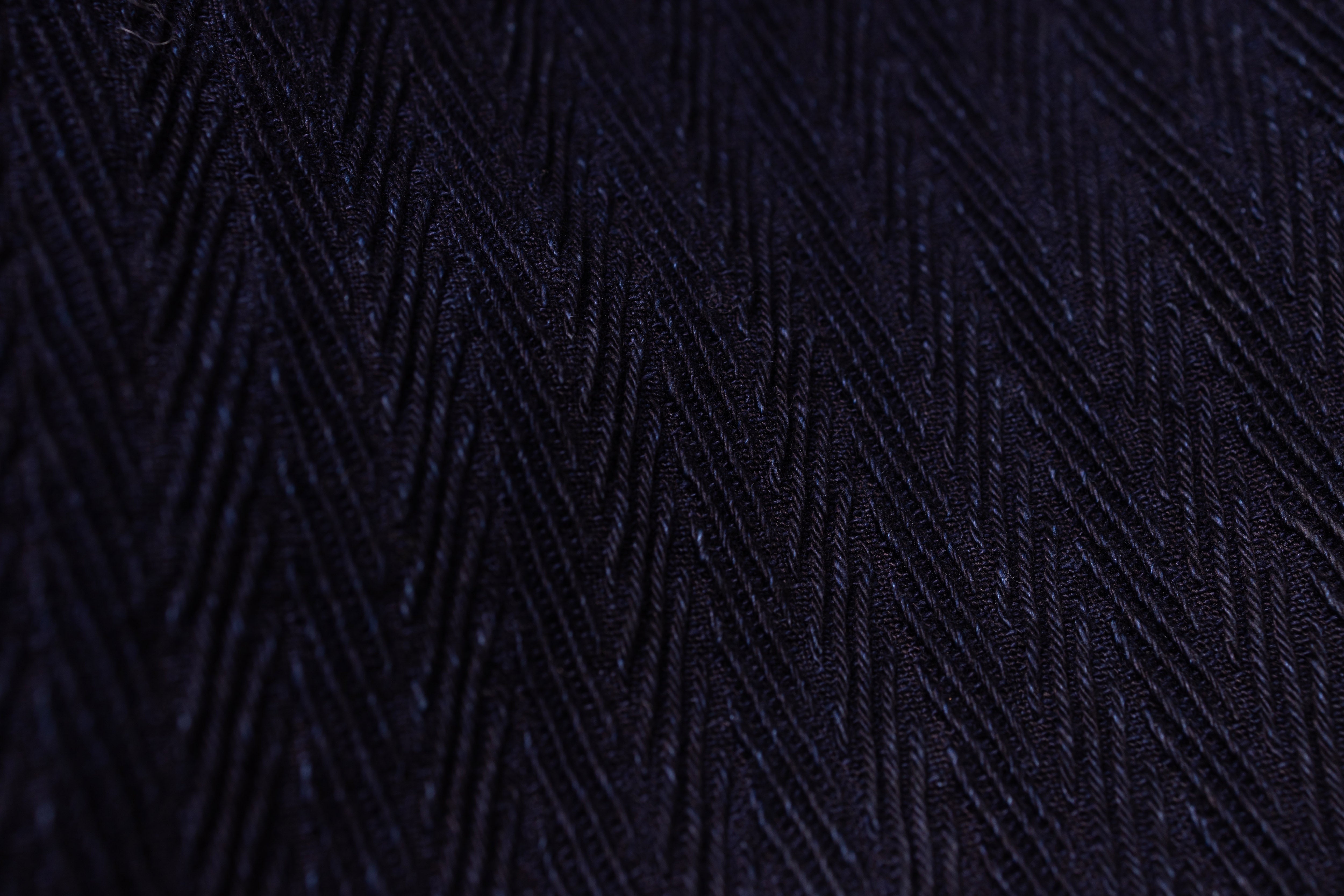 Dark blue textured fabric with geometric pattern