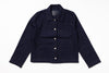 A dark navy blue corduroy utility jacket with a pointed collar, button front, and four front pockets, laid flat on a white background.