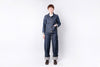 Person wearing a blue denim outfit on a white background