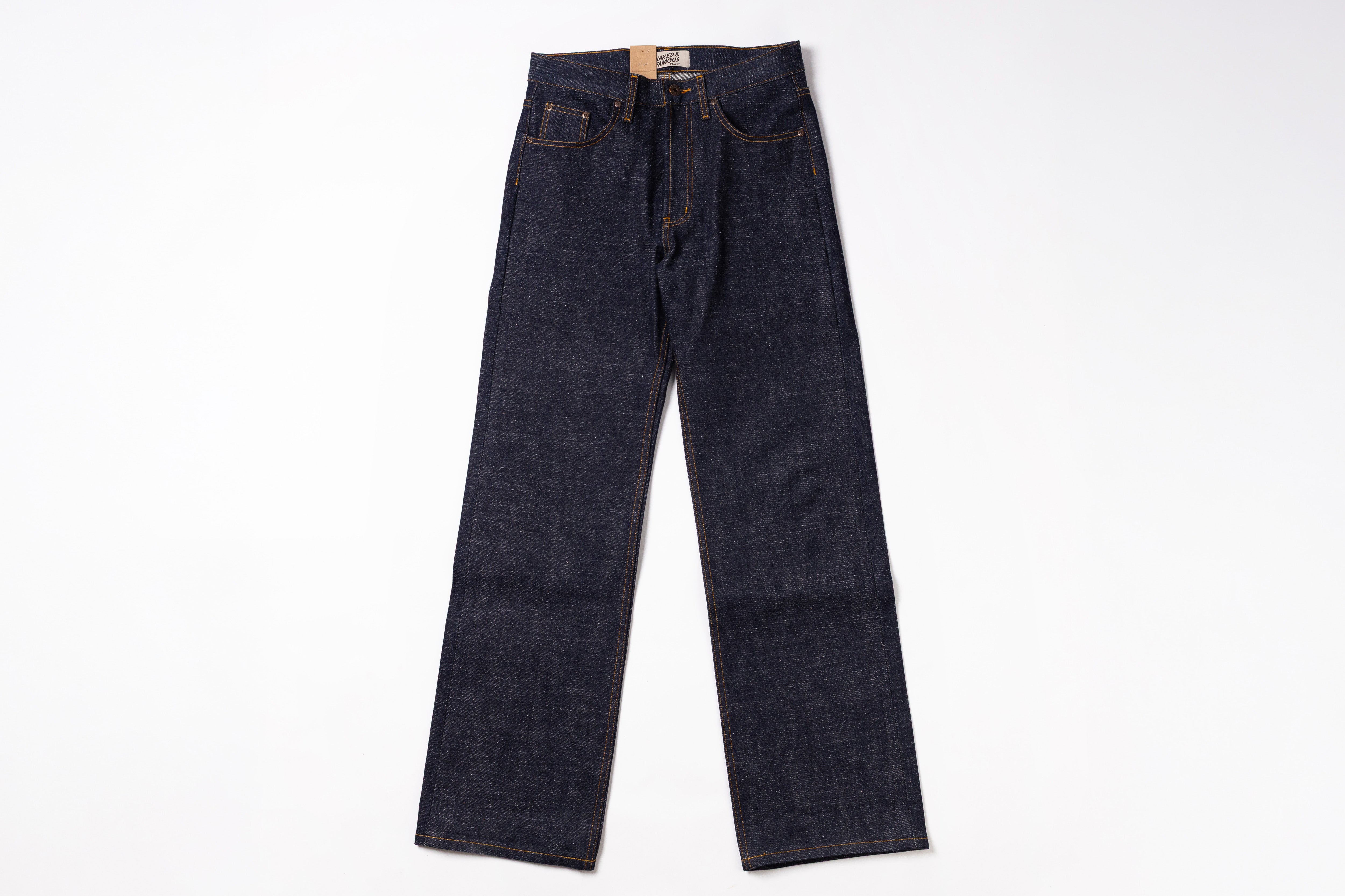 A pair of dark indigo denim jeans laid flat against a clean white background.