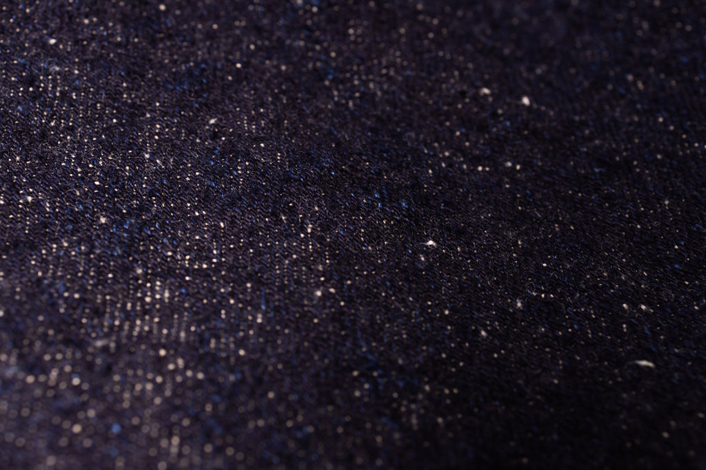 Close-up of a dark textured fabric surface