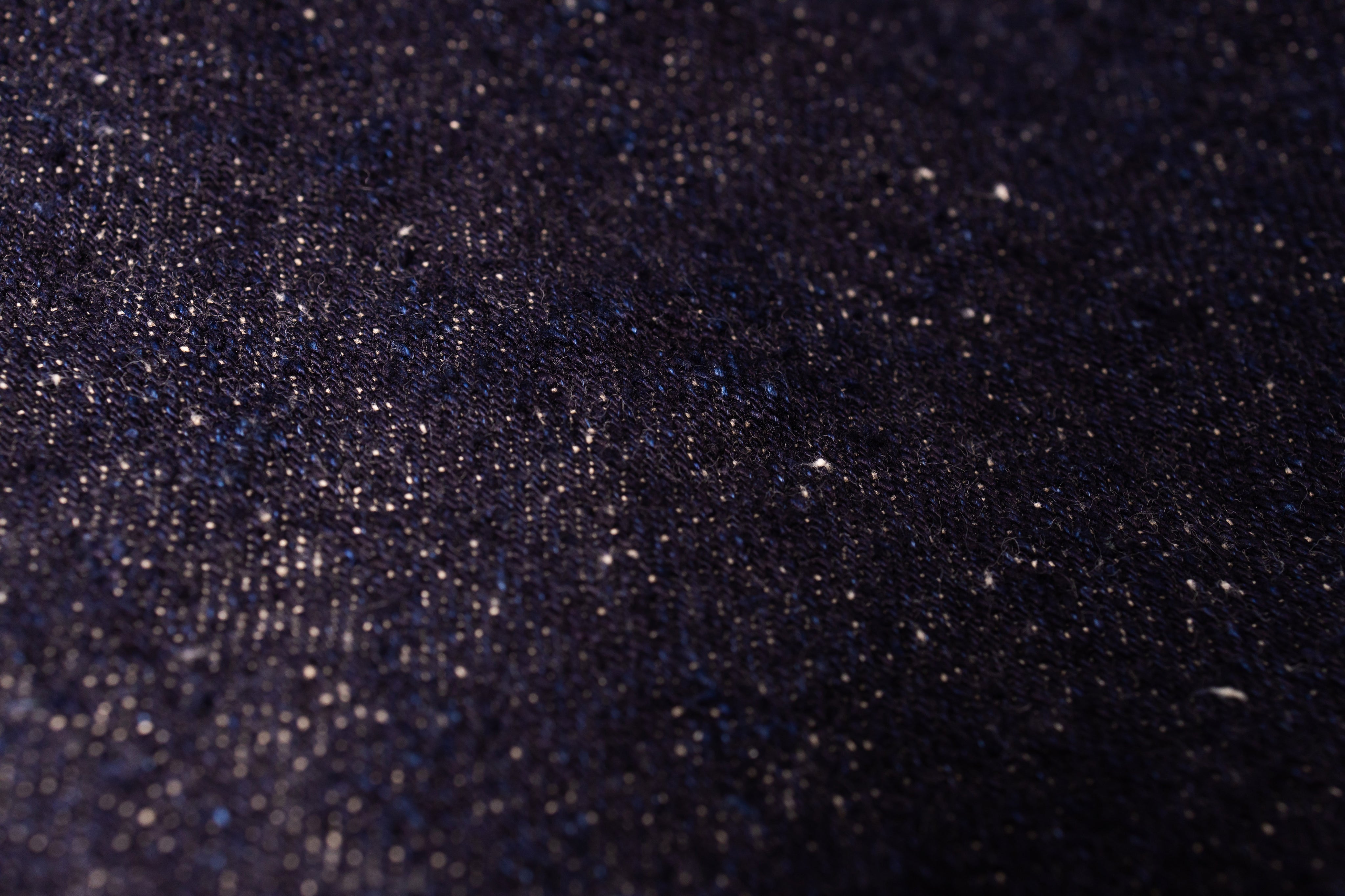 Close-up of a dark textured fabric surface