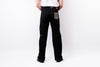 Rear view of a person wearing black straight-leg work pants with a gray patch pocket and a white shirt, standing against a white studio background.