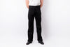 A person wearing black straight-leg jeans, a white t-shirt, and black leather shoes, standing against a plain white studio background.