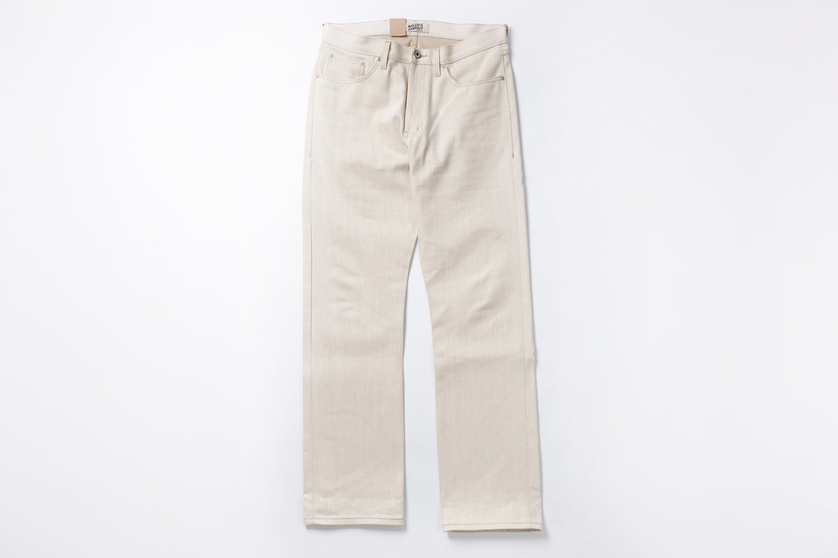 Ecru jeans on a white background