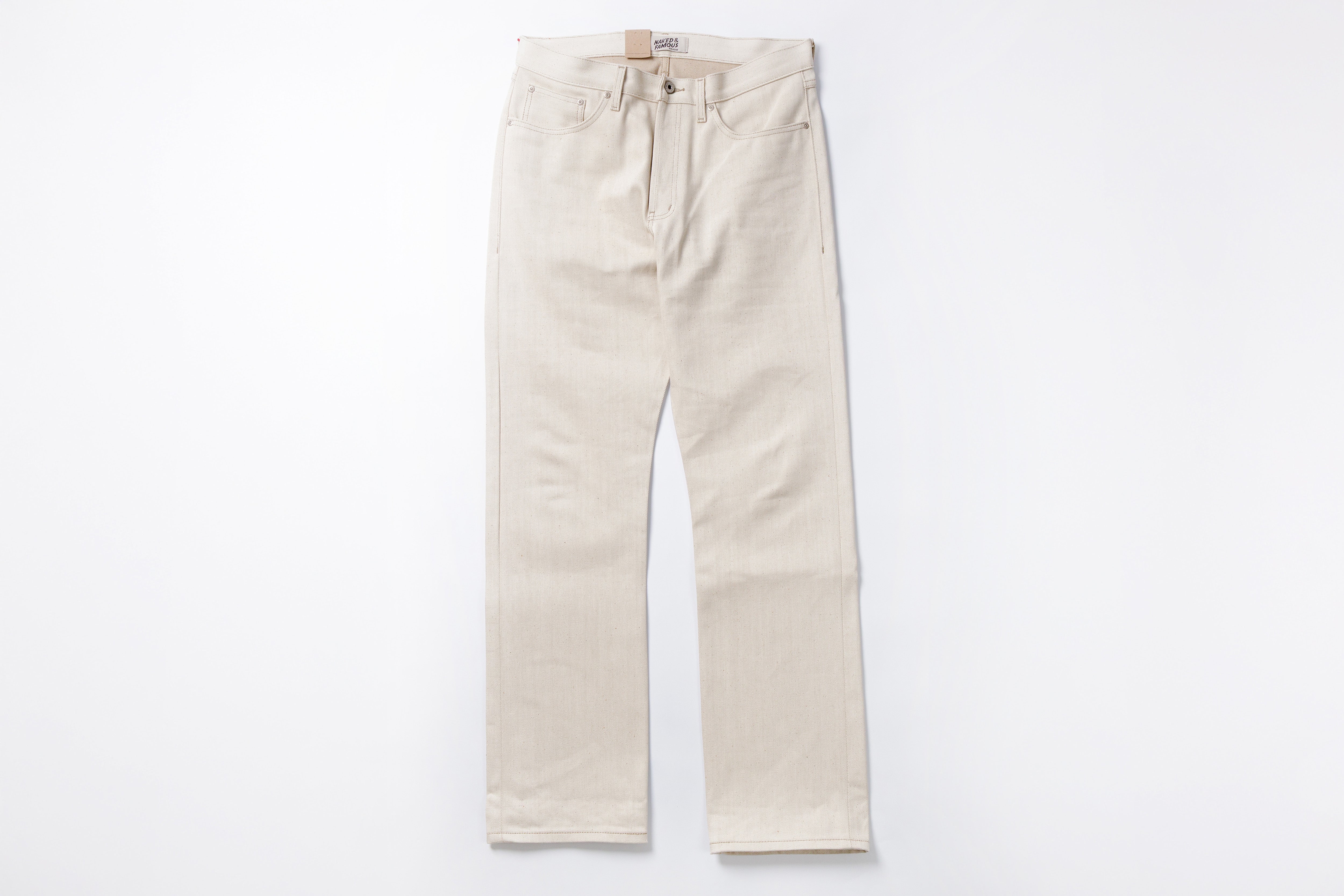 Ecru jeans on a white background