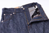 Close-up of blue denim jeans with a focus on stitching and material texture.