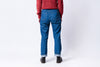 Person wearing blue jeans and a red sweater on a white background