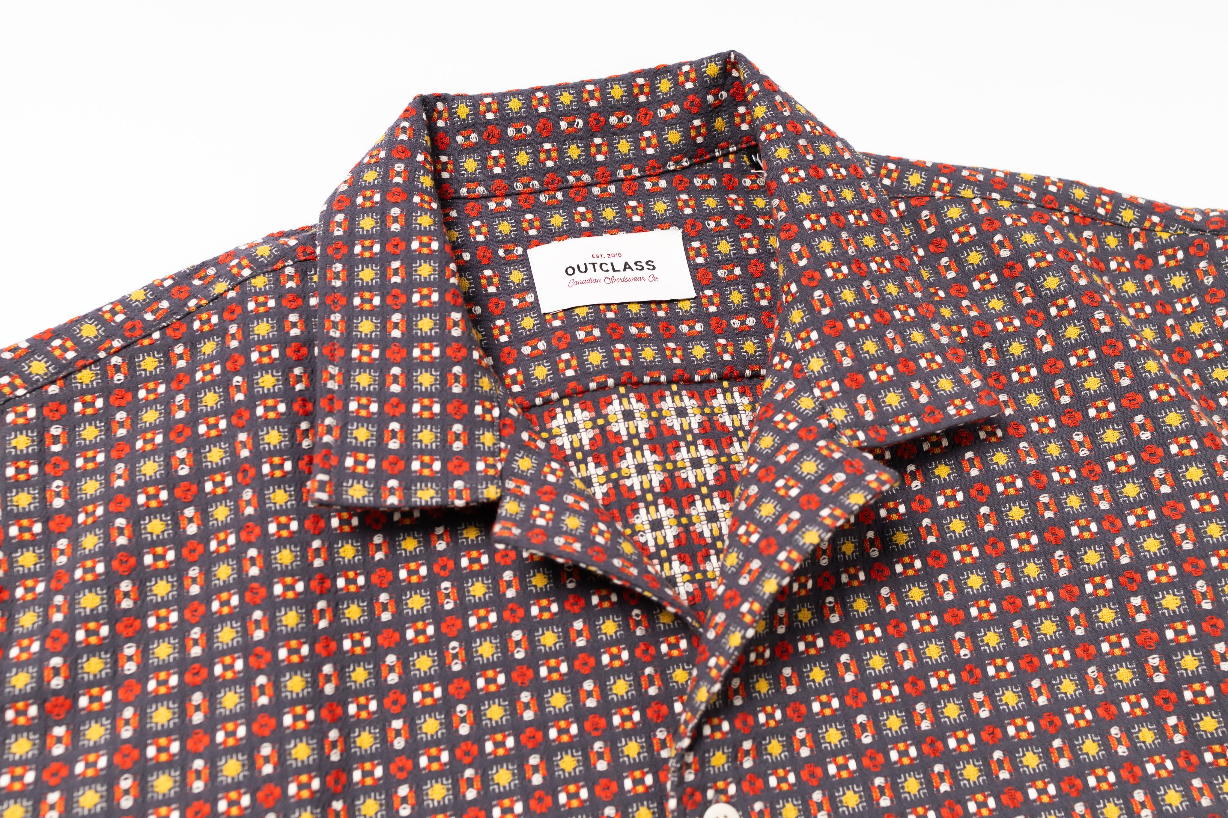 Patterned shirt with a visible brand label on a white background