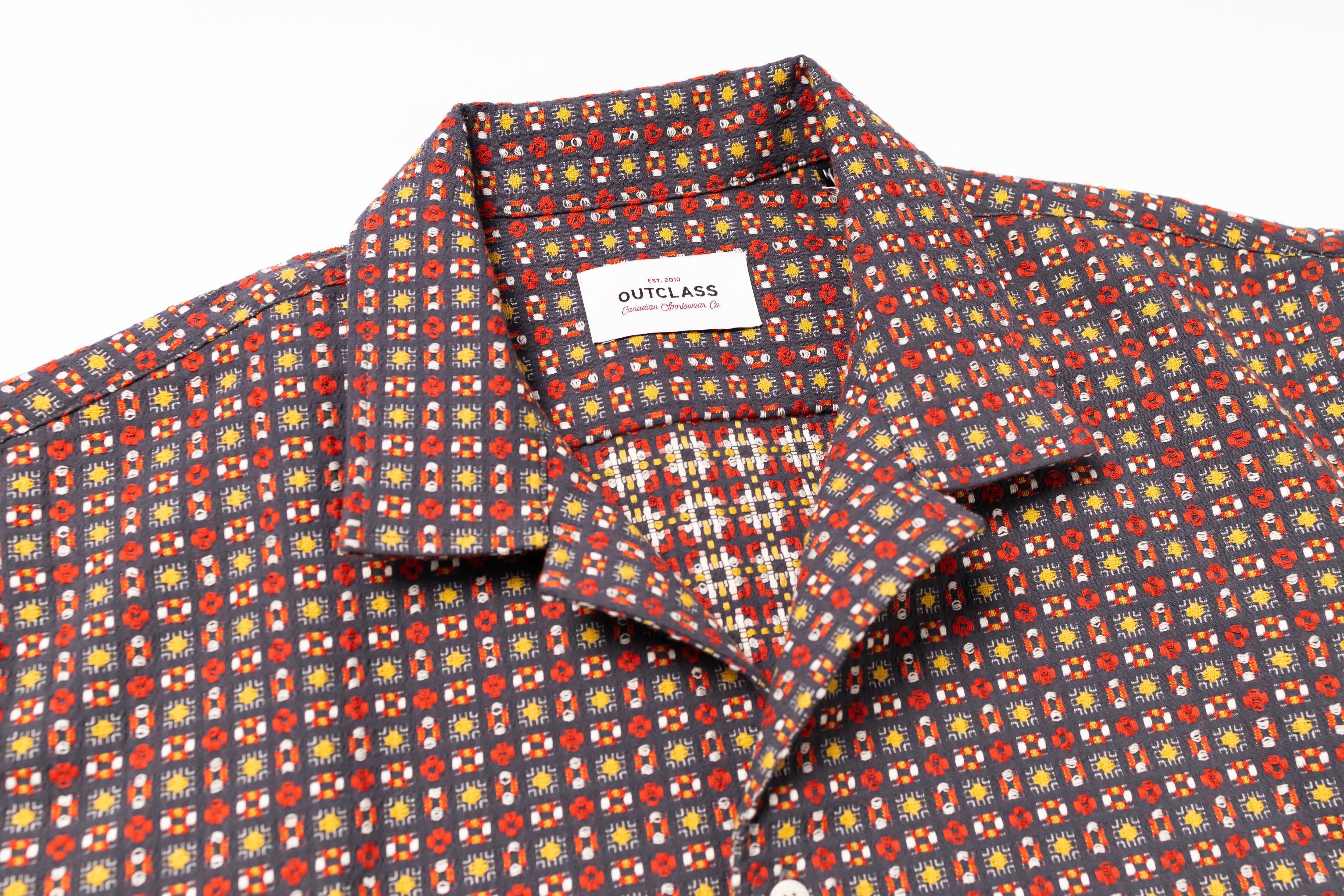 Patterned shirt with a visible brand label on a white background