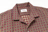 Patterned shirt with a visible brand label on a white background