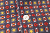 Close-up of a patterned fabric with a button in the center
