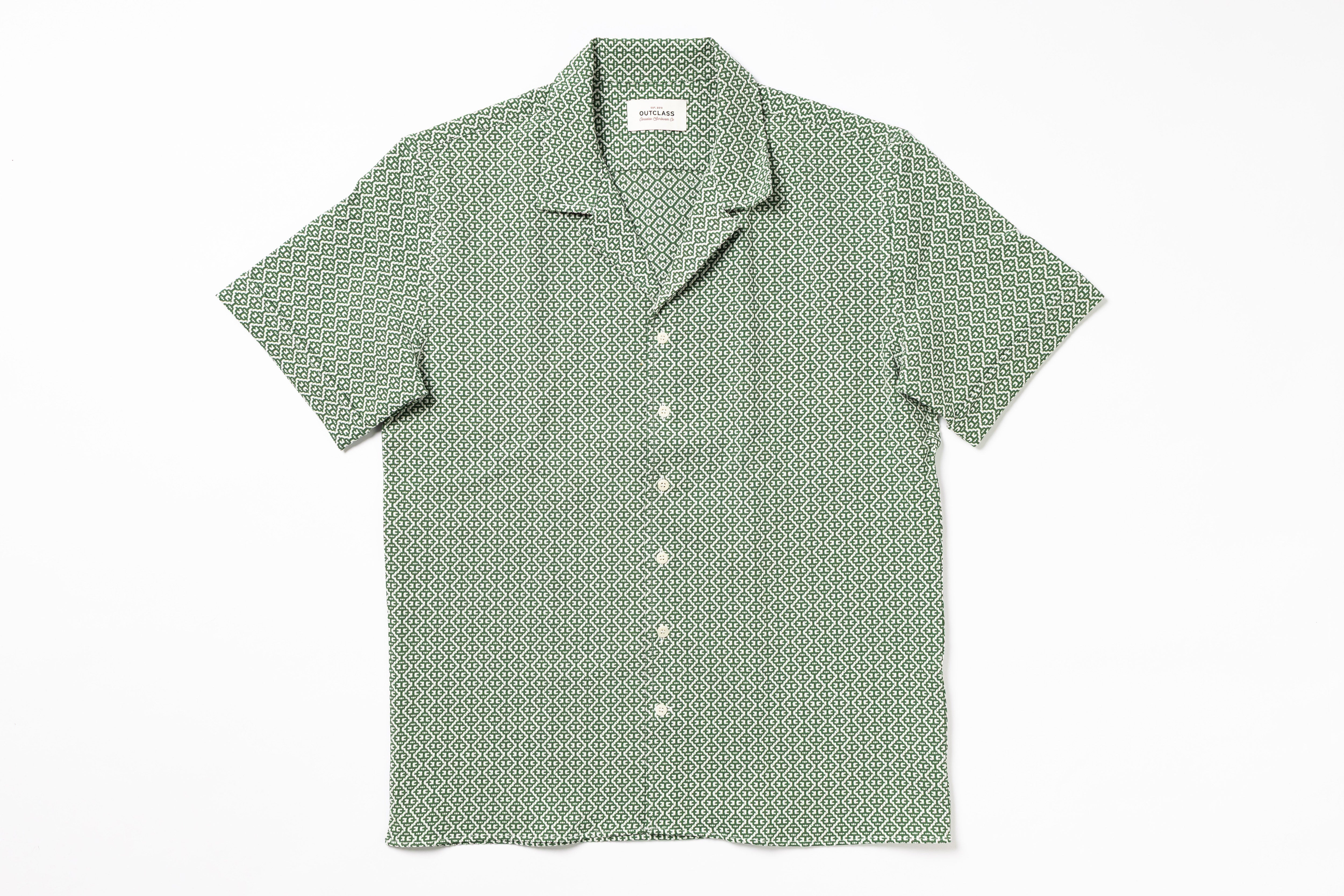 Green patterned shirt on a white background