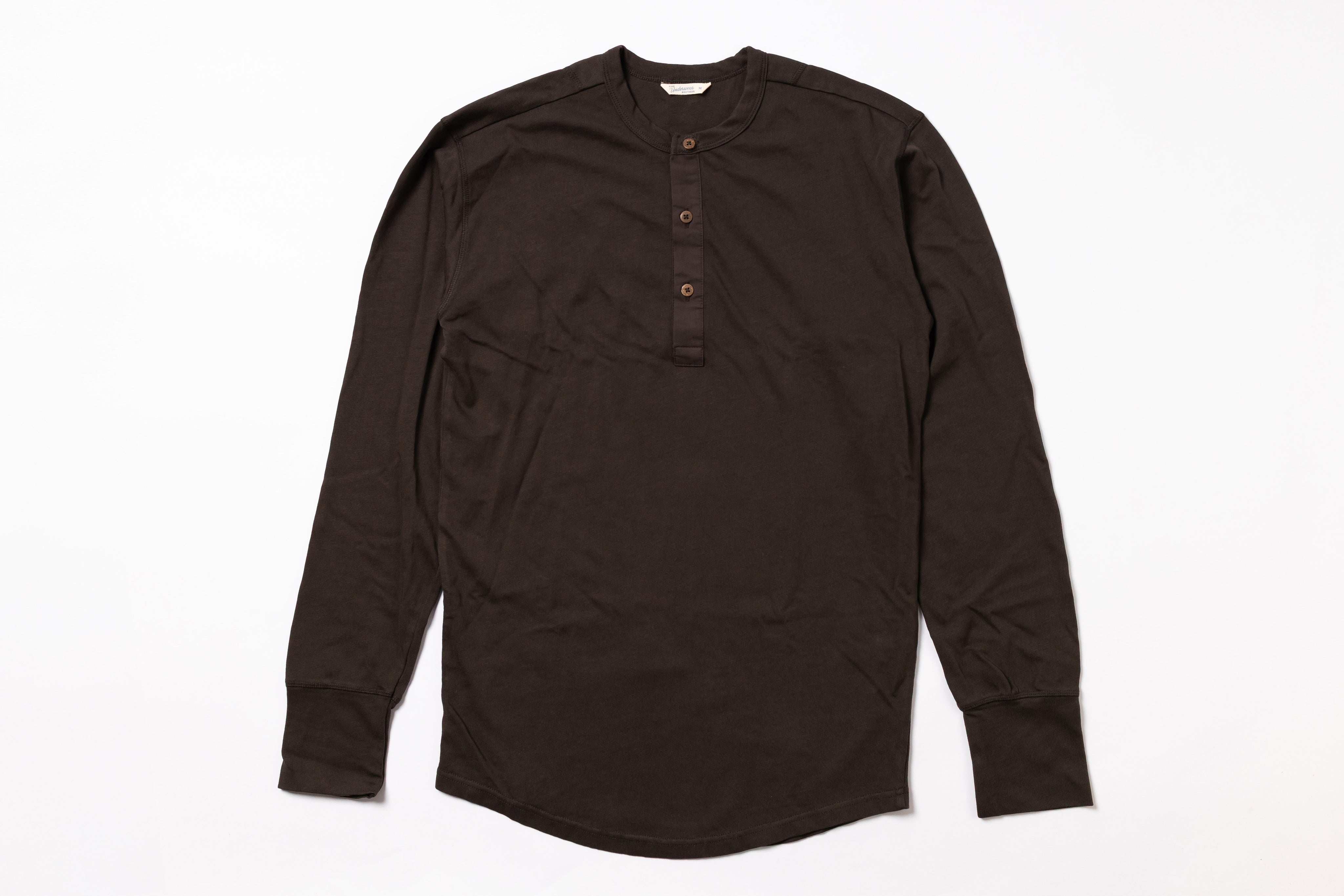 Brown long-sleeve shirt with buttons on a white background