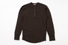 Brown long-sleeve shirt with buttons on a white background