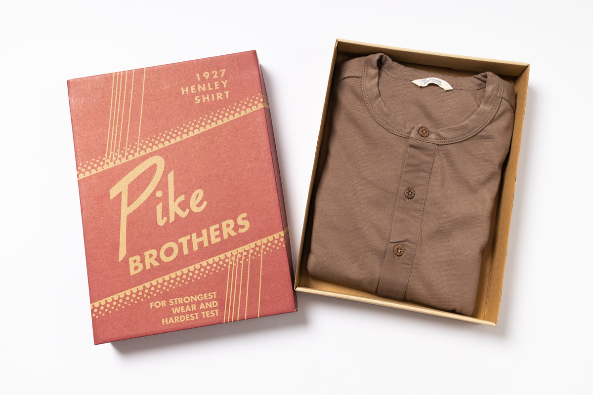 Brown shirt in a box with a Pike Brothers packaging box on a white background