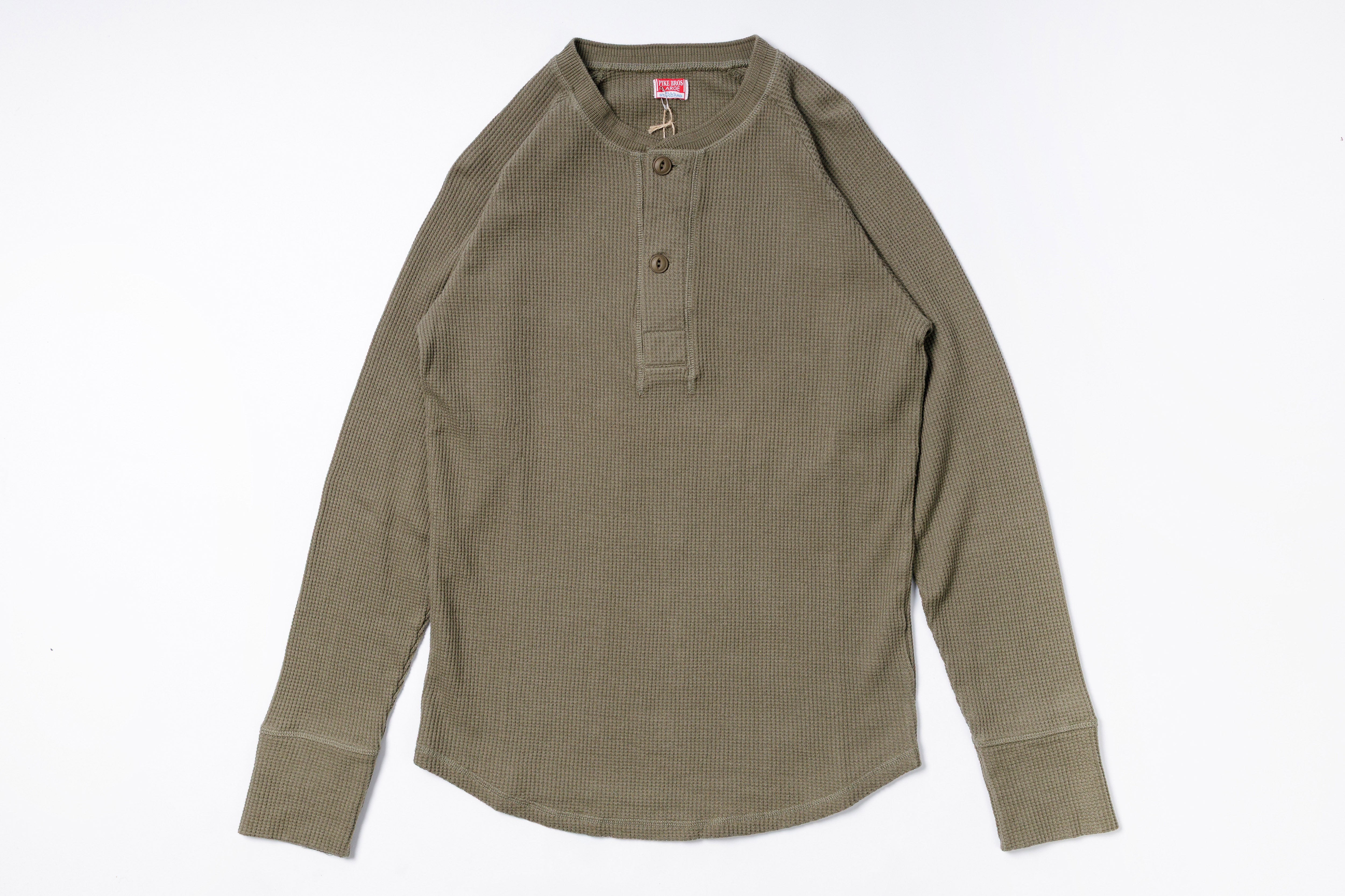 Green long-sleeve shirt on a white background