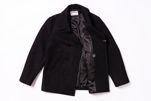 Black coat with a visible brand label on a white background