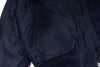 Close-up of a dark blue jacket with a pocket on a white background