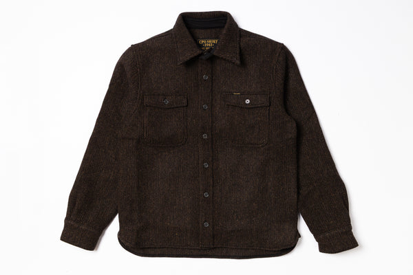 Brown shirt with button details on a white background