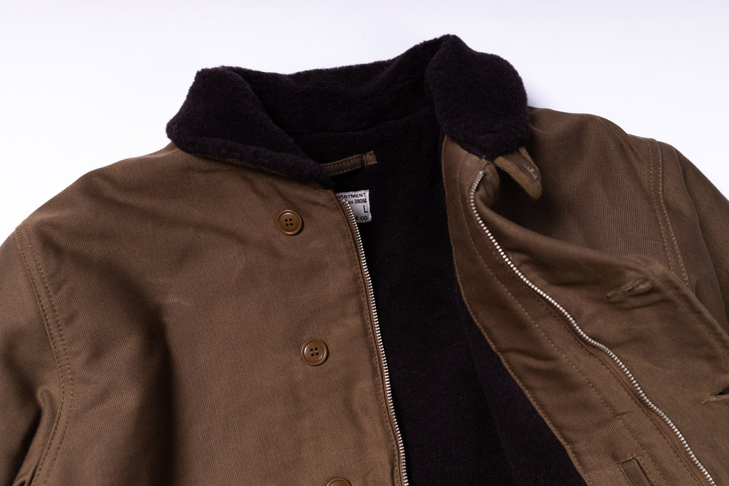 Brown jacket with a black collar on a white background