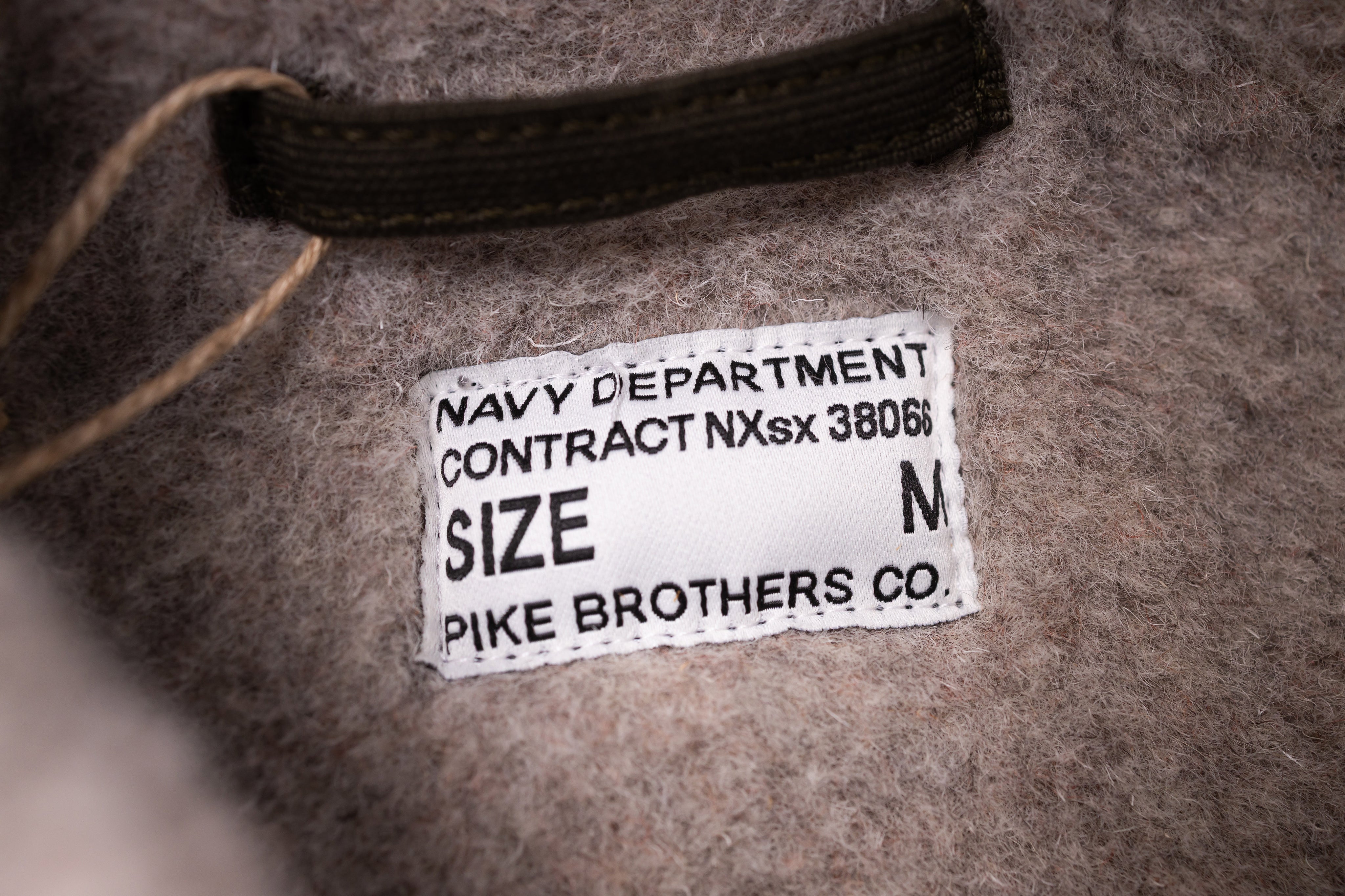 Label on a textured surface with text and branding details.