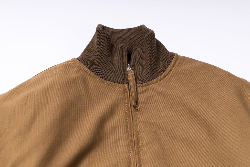 Brown jacket with a quarter zip on a white background