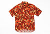 Short-sleeve shirt with red and orange floral pattern on a white background