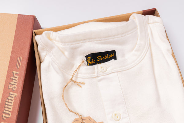 White shirt with 'Pike Brothers' label in an open box