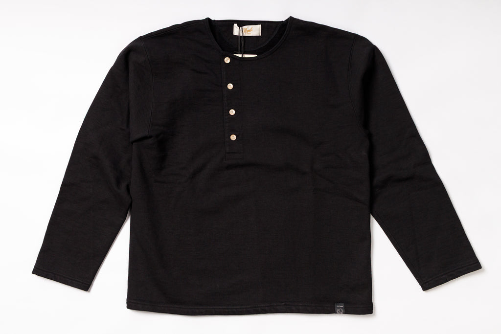 Black long-sleeve shirt with button details on a white background