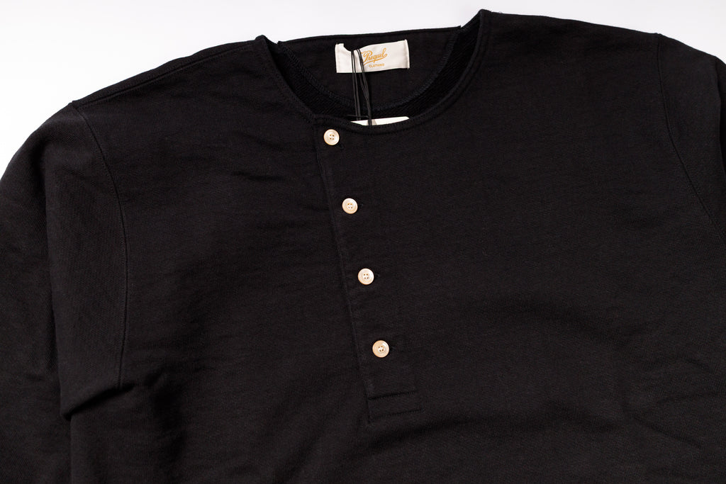 Black henley shirt with buttons on a white background
